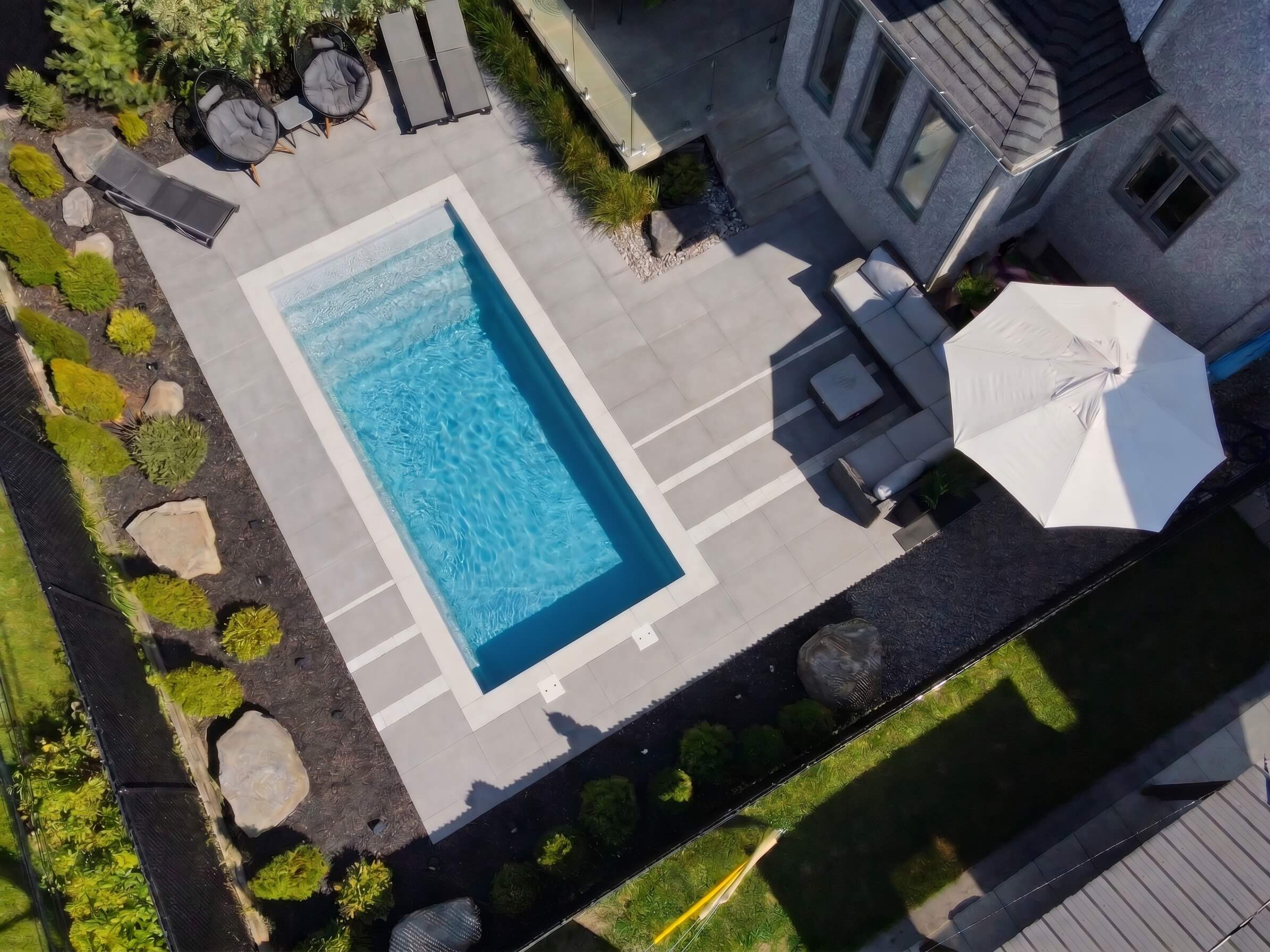 Piscine fibre de verre 11x23 — réalisation Piscine Riviera